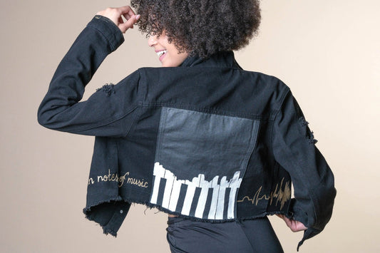 piano key board hand painted on black denim jacket. Cropped hand painted jean jacket with music notes